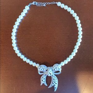 Pearl diamond bow statement necklace